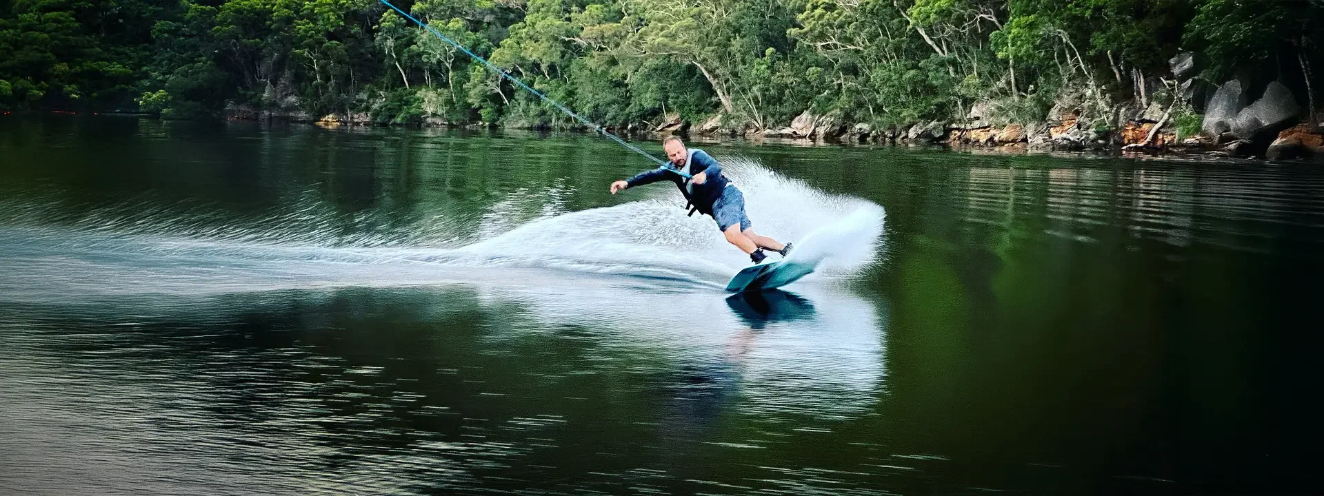 photo of man wakeboarding on Ronix District Wakeboard